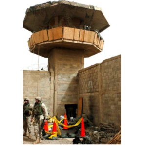 guard tower at Abu Ghraib Prison showing destruction post battle
