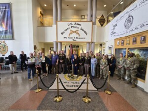 Command Sergeant Major, James Breckinridge, Order of Marechaussee in Gold recipient poses with ceremony attendees.